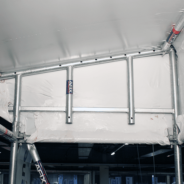 Afixfast X52 shrinkwrap scaffold with roof construction